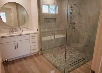 Contemporary ADU bathroom in Los Angeles County featuring a glass walk-in shower and clean, modern finishes