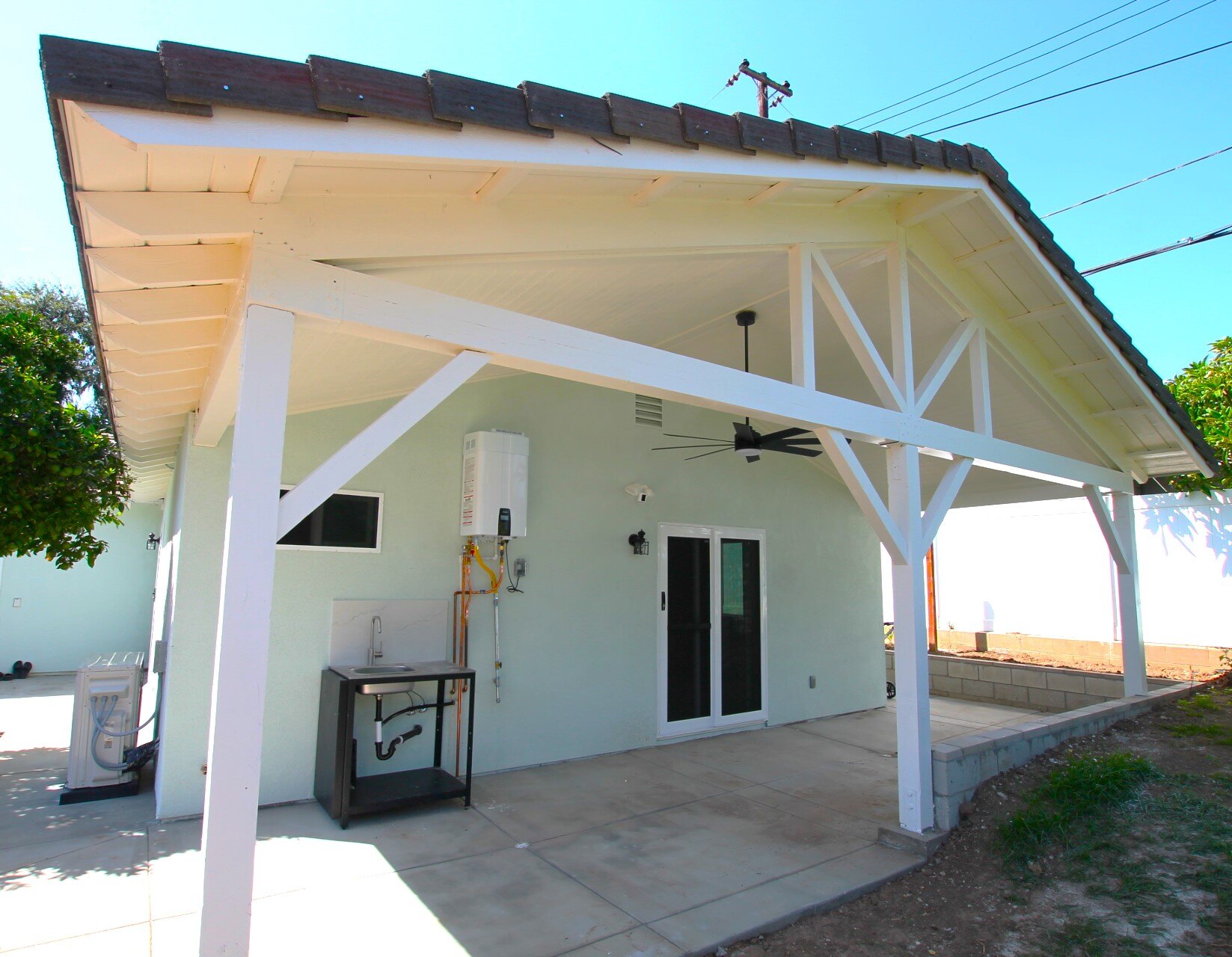 Detached ADU in San Bernardino County featuring a covered patio and shaded outdoor space